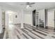 This finished basement has unique wood-look floors, recessed lighting, and an enclosed staircase at 339 Diane Se Dr, Smyrna, GA 30082