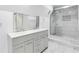 Modern bathroom features double sink vanity and tiled glass shower at 339 Diane Se Dr, Smyrna, GA 30082