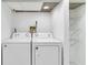 Well-lit laundry room with modern washer and dryer appliances at 339 Diane Se Dr, Smyrna, GA 30082