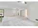 Large living room featuring neutral carpet, a ceiling fan, and access to other rooms at 339 Diane Se Dr, Smyrna, GA 30082