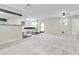 Spacious living area with light-colored carpet, a ceiling fan, and an open view to the kitchen at 339 Diane Se Dr, Smyrna, GA 30082