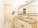Well-lit bathroom with double vanity, granite countertop, and ample storage space, perfect for a modern lifestyle at 3910 Ashford Lake Ne Ct, Brookhaven, GA 30319