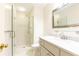 Bathroom featuring a glass shower door, tile flooring, mirror, vanity and toilet at 3910 Ashford Lake Ne Ct, Brookhaven, GA 30319