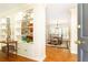 Elegant entryway featuring hardwood floors, built-in shelving, and an open view to the dining room at 3910 Ashford Lake Ne Ct, Brookhaven, GA 30319
