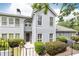 Charming two-story home with a well-manicured lawn and lush landscaping offering a welcoming curb appeal at 3910 Ashford Lake Ne Ct, Brookhaven, GA 30319