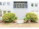 Home exterior showcasing a second-floor patio surrounded by landscaping at 3910 Ashford Lake Ne Ct, Brookhaven, GA 30319