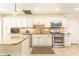 Well-appointed kitchen with stainless steel appliances, ample counter space, and abundant cabinet storage at 3910 Ashford Lake Ne Ct, Brookhaven, GA 30319