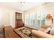 Comfortable living room with hardwood floors, neutral decor, and large windows offering plenty of natural light at 3910 Ashford Lake Ne Ct, Brookhaven, GA 30319