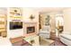 Inviting living room with a fireplace, hardwood floors, stylish decor, and comfortable seating at 3910 Ashford Lake Ne Ct, Brookhaven, GA 30319