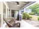 Outdoor patio featuring tile flooring, a ceiling fan, and outdoor seating at 3910 Ashford Lake Ne Ct, Brookhaven, GA 30319