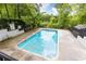 Relaxing community pool surrounded by lush greenery and a secure fence for safe enjoyment at 3910 Ashford Lake Ne Ct, Brookhaven, GA 30319