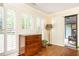 Bright sunroom with hardwood floors, shutters, and access to an outdoor patio offering relaxed living at 3910 Ashford Lake Ne Ct, Brookhaven, GA 30319