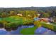 An aerial view of the community showing the golf course, lake, and clubhouse at 143 Lablanc Nw Way, Atlanta, GA 30327