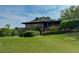 Exterior view of the clubhouse with beautiful landscaping at 143 Lablanc Nw Way, Atlanta, GA 30327
