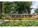 A close view of the Cross Creek entrance sign surrounded by vibrant landscaping at 143 Lablanc Nw Way, Atlanta, GA 30327