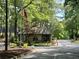 Cross Creek gatehouse with flags and access gate at 143 Lablanc Nw Way, Atlanta, GA 30327