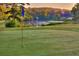 Beautiful golf course view with lush green grass and a tranquil lake at sunrise, a golfer's dream at 143 Lablanc Nw Way, Atlanta, GA 30327