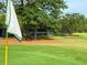 Scenic view of a golf course showcasing lush greenery and well-maintained fairways and a view of the tennis court at 143 Lablanc Nw Way, Atlanta, GA 30327