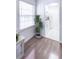 Cozy kitchenette featuring bright natural lighting and white appliances with hardwood floors in the hall at 143 Lablanc Nw Way, Atlanta, GA 30327