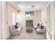 Sun-lit living area with neutral walls, fireplace, hardwood floors, white trim, and matching furniture set creating an inviting atmosphere at 143 Lablanc Nw Way, Atlanta, GA 30327