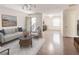Inviting living area with hardwood floors, white walls, an open door, and lots of natural light creating a cozy atmosphere at 143 Lablanc Nw Way, Atlanta, GA 30327