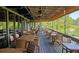 Outdoor patio with multiple tables and chairs and a view at 143 Lablanc Nw Way, Atlanta, GA 30327