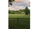 Scenic view of pond and green space, framed by trees and clouds at 143 Lablanc Nw Way, Atlanta, GA 30327