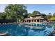 Community pool with clubhouse in the background at 143 Lablanc Nw Way, Atlanta, GA 30327