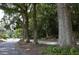 Quiet street lined with mature trees and lush greenery in the Cross Creek neighborhood at 143 Lablanc Nw Way, Atlanta, GA 30327