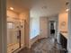 Well-lit bathroom featuring a glass-enclosed shower, soaking tub, and a dark wood vanity with a granite countertop at 3531 Lilly Brook Dr, Loganville, GA 30052