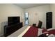 Bedroom featuring dark dresser, flat screen TV, and a leather chair at 3531 Lilly Brook Dr, Loganville, GA 30052
