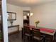 Inviting dining room featuring wood floors and a stylish light fixture at 3531 Lilly Brook Dr, Loganville, GA 30052
