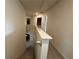 Bright hallway featuring neutral walls, carpet flooring, and access to multiple rooms at 3531 Lilly Brook Dr, Loganville, GA 30052