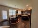 Open kitchen features an island, dark wood cabinets, and a breakfast nook at 3531 Lilly Brook Dr, Loganville, GA 30052