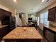 Gourmet kitchen with granite countertops and stainless steel appliances at 3531 Lilly Brook Dr, Loganville, GA 30052