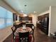 Eat-in kitchen featuring dark wood cabinets and stainless steel appliances at 3531 Lilly Brook Dr, Loganville, GA 30052
