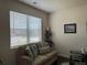 Cozy living room with comfortable seating and natural light at 3531 Lilly Brook Dr, Loganville, GA 30052
