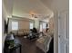 Bright living room featuring lots of seating, a ceiling fan and neutral colors to make the room seem even more roomy at 3531 Lilly Brook Dr, Loganville, GA 30052