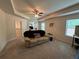 Inviting living room with a comfortable sofa, ceiling fan, and ample natural light at 3531 Lilly Brook Dr, Loganville, GA 30052