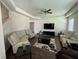 Bright living room featuring lots of seating, a ceiling fan and neutral colors to make the room seem even more roomy at 3531 Lilly Brook Dr, Loganville, GA 30052