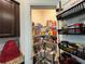 Walk-in pantry with shelving stocked with food and organizational products at 3531 Lilly Brook Dr, Loganville, GA 30052