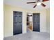 Bedroom with carpet floors and two dark doors at 3550 Willow Tree Trce, Decatur, GA 30034