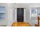 Inviting entryway with hardwood floors, front door with curtains, and natural light at 3550 Willow Tree Trce, Decatur, GA 30034
