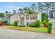 Charming two-story home with landscaped yard and inviting curb appeal on a sunny day at 3550 Willow Tree Trce, Decatur, GA 30034