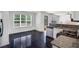 Modern kitchen with granite countertops, stainless steel appliances, and black tile flooring at 3550 Willow Tree Trce, Decatur, GA 30034