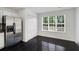 Bright kitchen features stainless fridge, black tile flooring and a large window at 3550 Willow Tree Trce, Decatur, GA 30034