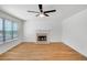 Living room with wood floors, fireplace, and ceiling fan at 3550 Willow Tree Trce, Decatur, GA 30034
