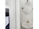 Cozy powder room featuring a vanity with sink and an oval mirror, next to kitchen at 3550 Willow Tree Trce, Decatur, GA 30034
