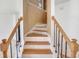 Stairway with oak handrail, wrought iron balusters, and wood stairs at 3550 Willow Tree Trce, Decatur, GA 30034