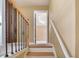 Carpeted stairs with oak railings and wrought iron spindles at 3550 Willow Tree Trce, Decatur, GA 30034